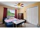 Bedroom with window and large closet at 12935 Solola Way, Trinity, FL 34655