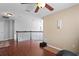 Upstairs bonus room featuring hardwood floors, neutral walls and a ceiling fan at 12935 Solola Way, Trinity, FL 34655