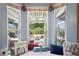 Bright Breakfast Nook with white trim windows and a beautiful backyard view at 12935 Solola Way, Trinity, FL 34655