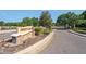 A stone sign and gated entrance welcome you into the Trinity East community at 12935 Solola Way, Trinity, FL 34655