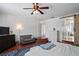View of the main bedroom with a barn door entrance to bathroom and walk-in closet at 12935 Solola Way, Trinity, FL 34655