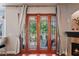 Patio access from indoors with a fireplace at 12935 Solola Way, Trinity, FL 34655