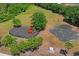 Community playground aerial view featuring a modern play structure and swing set in a well maintained area at 12935 Solola Way, Trinity, FL 34655