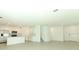 Spacious open-concept floorplan combining living, dining, and kitchen areas with tile flooring and recessed lighting at 13261 Tropical Breeze Way, Hudson, FL 34669