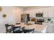 Kitchen boasts modern appliances, white cabinets, a large island, and stylish bar stool seating at 13273 Tropical Breeze Way, Hudson, FL 34669