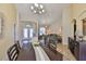 Bright dining room and living area with tile floors and high ceilings, with decor at 13742 Artesa Bell Dr, Riverview, FL 33579
