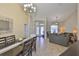 Bright dining room and living area with high ceilings and tile floors in an open layout at 13742 Artesa Bell Dr, Riverview, FL 33579