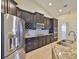 Gourmet kitchen featuring stainless steel appliances and granite countertops at 13742 Artesa Bell Dr, Riverview, FL 33579