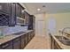 Well-equipped kitchen boasts granite countertops and modern appliances at 13742 Artesa Bell Dr, Riverview, FL 33579
