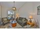 Comfortable living room with neutral tones, patterned furniture, and natural lighting at 13742 Artesa Bell Dr, Riverview, FL 33579