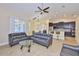 Inviting living room with natural light and open floor plan to the kitchen at 13742 Artesa Bell Dr, Riverview, FL 33579