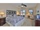 Serene main bedroom featuring a ceiling fan and sliding glass door at 13742 Artesa Bell Dr, Riverview, FL 33579