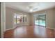 Spacious bedroom with bay window overlooking the pool and access to backyard at 13906 Captains Reef Ct, Tampa, FL 33624