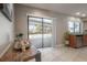 Dining area with a view of the pool through sliding glass doors and stainless steel appliances in the kitchen at 13906 Captains Reef Ct, Tampa, FL 33624