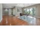 Bright dining room with large windows, chandelier, and views of the landscaped front yard, perfect for gatherings at 13906 Captains Reef Ct, Tampa, FL 33624