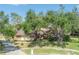 Charming single-Gathering home featuring a well-manicured lawn and mature shade trees in a tranquil suburban setting at 13906 Captains Reef Ct, Tampa, FL 33624