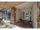 Inviting front porch features double doors, stone accents, and tiled flooring, creating a welcoming entrance at 13906 Captains Reef Ct, Tampa, FL 33624