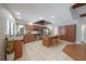 A spacious kitchen with stainless steel appliances, a central island with seating, and ample cabinet storage at 13906 Captains Reef Ct, Tampa, FL 33624