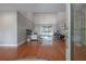 Bright living room featuring soaring ceilings, hardwood floors, and a large sliding glass door leading to outdoor space at 13906 Captains Reef Ct, Tampa, FL 33624