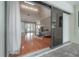 Bright and open living room flows to a covered patio offering views of the screened-in pool and outdoor space at 13906 Captains Reef Ct, Tampa, FL 33624