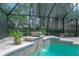 Pool with waterfall feature and landscaping at 13906 Captains Reef Ct, Tampa, FL 33624