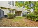 Inviting backyard with a covered patio, lush lawn, and privacy fence, perfect for outdoor enjoyment at 14537 Mirabelle Vista Cir, Tampa, FL 33626