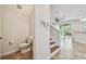 Powder room with tile flooring and nearby stairs to the second floor at 14537 Mirabelle Vista Cir, Tampa, FL 33626