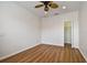 Bedroom featuring wood-look floors, a ceiling fan and a walk-in closet at 14537 Mirabelle Vista Cir, Tampa, FL 33626