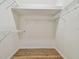 Walk-in closet with adjustable shelving and wood flooring at 14537 Mirabelle Vista Cir, Tampa, FL 33626