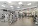 Well-equipped gym with modern exercise machines, free weights, and motivational wall decor at 14537 Mirabelle Vista Cir, Tampa, FL 33626