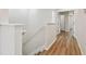 Hallway with wood floors leading to bedrooms and bathrooms at 14537 Mirabelle Vista Cir, Tampa, FL 33626