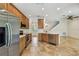 Bright kitchen features stainless steel appliances, wood cabinets, and tile floors at 14537 Mirabelle Vista Cir, Tampa, FL 33626