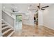 Open-concept living room showcases tile flooring, recessed lighting, and seamless transition to the kitchen at 14537 Mirabelle Vista Cir, Tampa, FL 33626
