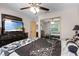 Bedroom with a large flat screen TV and a mirrored closet at 1486 Mahogany Ln # 703, Palm Harbor, FL 34683