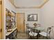 Dining room features a glass table, seating for four, and stylish decor at 1486 Mahogany Ln # 703, Palm Harbor, FL 34683