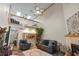 Spacious living room featuring a loft, fireplace, and elegant decor at 1486 Mahogany Ln # 703, Palm Harbor, FL 34683