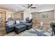 Upstairs living area with wood look floors, modern furniture, and a ceiling fan at 1486 Mahogany Ln # 703, Palm Harbor, FL 34683
