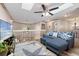 Upstairs living area with wood look floors, modern furniture, and a ceiling fan at 1486 Mahogany Ln # 703, Palm Harbor, FL 34683