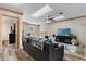 Upstairs living area with wood look floors, modern furniture, and a ceiling fan at 1486 Mahogany Ln # 703, Palm Harbor, FL 34683