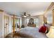 Serene bedroom with a four-poster bed, ample natural light, and stylish decor at 1486 Mahogany Ln # 703, Palm Harbor, FL 34683