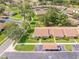 Aerial view of the home showcasing the landscaping, carport, and proximity to community amenities at 15 Tads Trl, Oldsmar, FL 34677