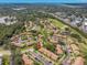 High-altitude view displaying the property within a well-maintained community, near a golf course at 15 Tads Trl, Oldsmar, FL 34677