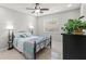 Bedroom featuring a ceiling fan, window with blinds, tile flooring, and neutral paint at 15 Tads Trl, Oldsmar, FL 34677