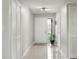 Bright entryway with tiled flooring and natural light, featuring a closet and neutral decor at 15 Tads Trl, Oldsmar, FL 34677