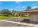 Exterior view of a carport showing structure and yard at 15 Tads Trl, Oldsmar, FL 34677