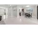 Open living space featuring tile flooring, dining area and partial view of kitchen at 15 Tads Trl, Oldsmar, FL 34677