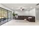 Bright living room featuring tile floors, comfortable seating, and access to the outdoor patio at 15 Tads Trl, Oldsmar, FL 34677