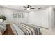 Cozy main bedroom with a ceiling fan and tiled floors at 15 Tads Trl, Oldsmar, FL 34677