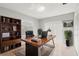Office featuring a large desk, bookshelf, sliding glass doors, and a neutral paint color at 15 Tads Trl, Oldsmar, FL 34677