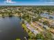 Beautiful aerial shot of lakeside homes nestled among mature trees, offering a tranquil and picturesque setting at 1501 84Th N Ave, St Petersburg, FL 33702